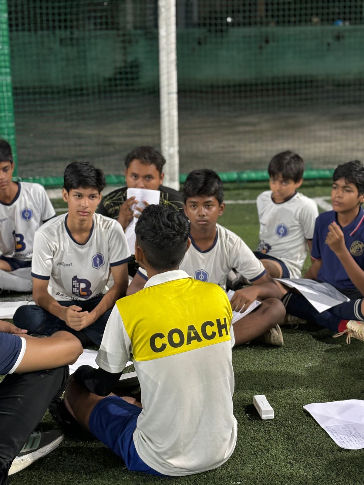 WeSport Guwahati Football Coach conducting tactical session with young players - Best Football Academy in Assam